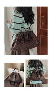 Detail of leopard print tote bag featuring retro metal clasp and versatile straps