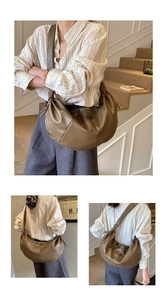 Detail of the pleated crescent bag showing soft textured olive brown faux leather with strap