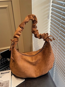 Vintage caramel brown suede crescent tote bag with soft pleated handle and bow details