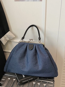 Vintage navy denim doctor tote bag with pleated design and silver kiss-lock closure