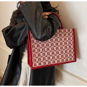 Detail of bridal tote bag with red Double Happiness pattern and premium woven texture