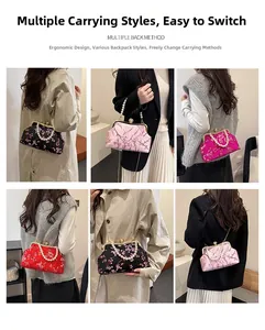 Detail view of vintage embroidery handbag with pearl handle and multiple carrying styles