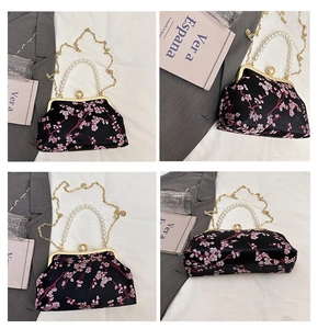 Detailed views of a black embroidered qipao bag with pearl handle and golden chain
