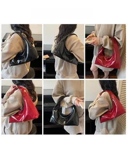 Multiple views showing the black and red glossy patent leather hobo bag on a model