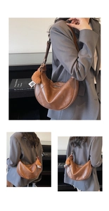 Detail of a brown crescent moon shoulder bag featuring litchi texture and heart charm