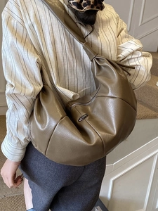 Olive green half-moon crossbody bag with soft pleated PU leather and wide knot strap