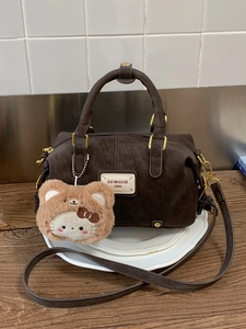 Retro dark brown Boston pillow bag with top handle, long strap and cute plush charm