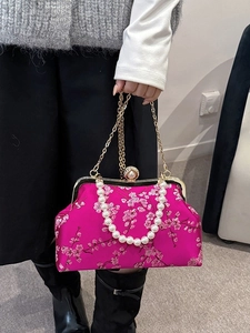 Pink silk evening bag with cherry blossom embroidery and elegant pearl bead handle