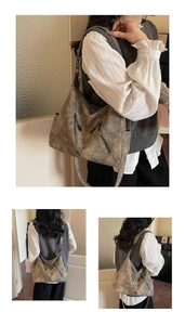 Gros plan du sac hobo vintage avec zips argentés et détails en cuir texturé