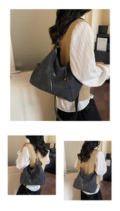 Détail du grand sac cabas gris foncé avec fermetures éclair verticales fonctionnelles