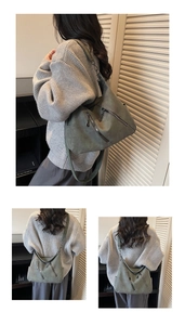 Gros plan sur le sac hobo vert foncé avec doubles fermetures éclair et texture en daim
