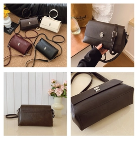 Detail of elegant rectangular crossbody bag with silver twist lock and adjustable strap