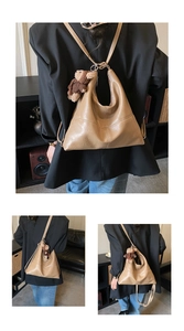 Detail of khaki tote bag with cross-stitch pattern and cute plush bear accessory