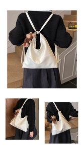 Detail of cream white quilted leather tote showing versatile backpack and shoulder straps