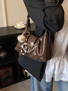 Retro coffee brown shoulder bag with pleated leather texture and gold hardware for women