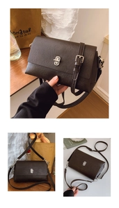Detail of dark brown leather crossbody bag featuring a silver twist lock and flap design