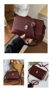 Detail of burgundy crossbody bag featuring a silver twist lock and smooth leather texture