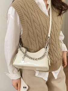 Vintage cream faux leather baguette bag with silver chain and heart charm detail