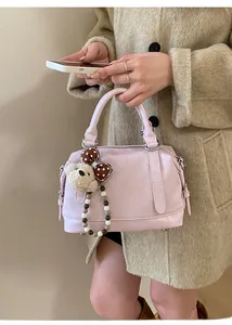 Pink PU Boston handbag featuring silver hardware and a cute brown polka-dot bear charm