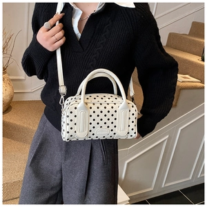Polka dot Boston bag with double handles and logo detail on white synthetic leather