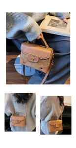 Detail of contrast leather shoulder bag with oval metal lock and detachable strap