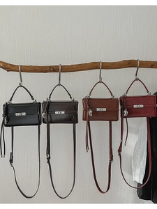 Detailed display of four vintage box bags in black, coffee, caramel and wine red colors