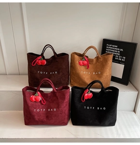 Detailed grid view of minimalist tote bags in four colors with cherry charms