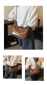 Detailed view of deep brown crescent shoulder bag with glossy finish and stitching