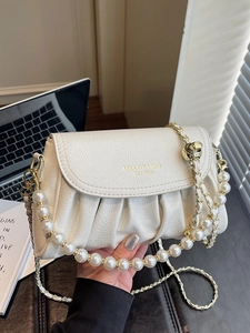 White pleated leather crossbody cloud bag with pearl handle and metal chain strap