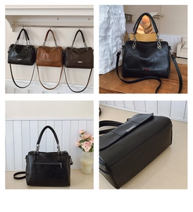 Detail view of vintage Boston bag showing back zipper pocket and textured PU leather finish