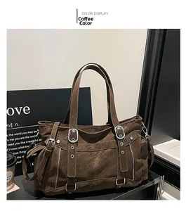 Detailed view of coffee tote bag with vintage metal buckles and aged leather texture
