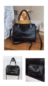 Detailed close-up of black checkered embossed leather bag with silver metal hardware