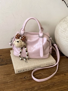 Pink Boston handbag in soft leather with bear charm and adjustable shoulder strap