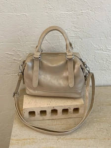 Champagne gold Boston handbag in soft pearlescent leather with detachable shoulder strap