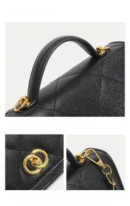 Detail of black caviar leather mini bag with quilted stitching and gold metal hardware