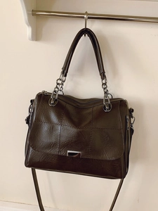 Brown vintage shoulder bag with rectangular stitching, chain strap and multiple zippers