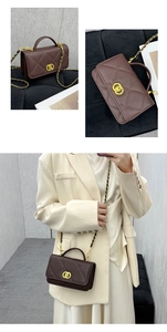 Macro view of dark brown quilted leather crossbody bag with golden hardware and chain strap