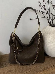 Deep brown retro hobo tote bag in suede leather with adjustable strap and metal chain detail