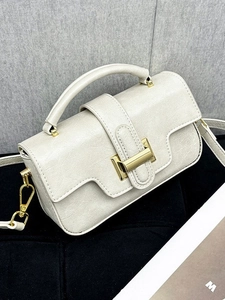 Creamy white vintage tote bag with fine cracked texture and gold buckle closure