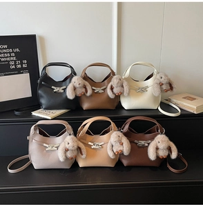 Detailed display of bucket bags in six colors with leather texture and cute rabbit charms