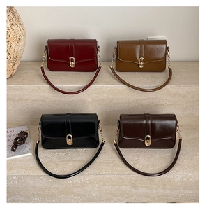Detail showing four vintage crossbody bags with glossy finish and elegant metal locks