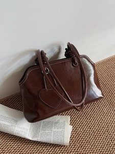 Chic dark brown faux leather tote bag with heart stitching and elegant knot handle