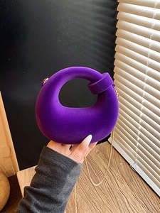Unique purple velvet handbag with knot handle and elegant gold chain strap for women