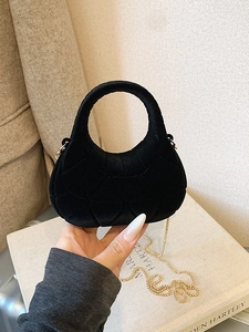 Chic black mini quilted velvet handbag with elegant gold chain strap and integrated handle