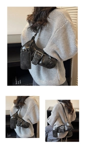 Detailed macro view of black vintage biker style shoulder bag with metal buckle straps