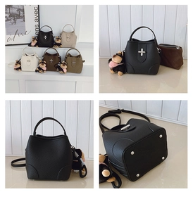 Detail of colorful pebbled leather bucket bags with metal cross buckles and plush charms