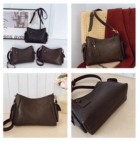 Dettaglio ravvicinato della borsa a tracolla vintage marrone scuro con tasche laterali