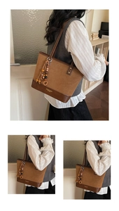 Detail of retro brown tote bag showing mixed suede texture and MILANO logo branding