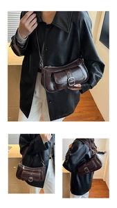 Detailed views of dark brown faux oil wax leather baguette bag on a model from three angles