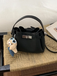 Retro black leather bucket bag with silver lock, top handle and cute plush dog charm